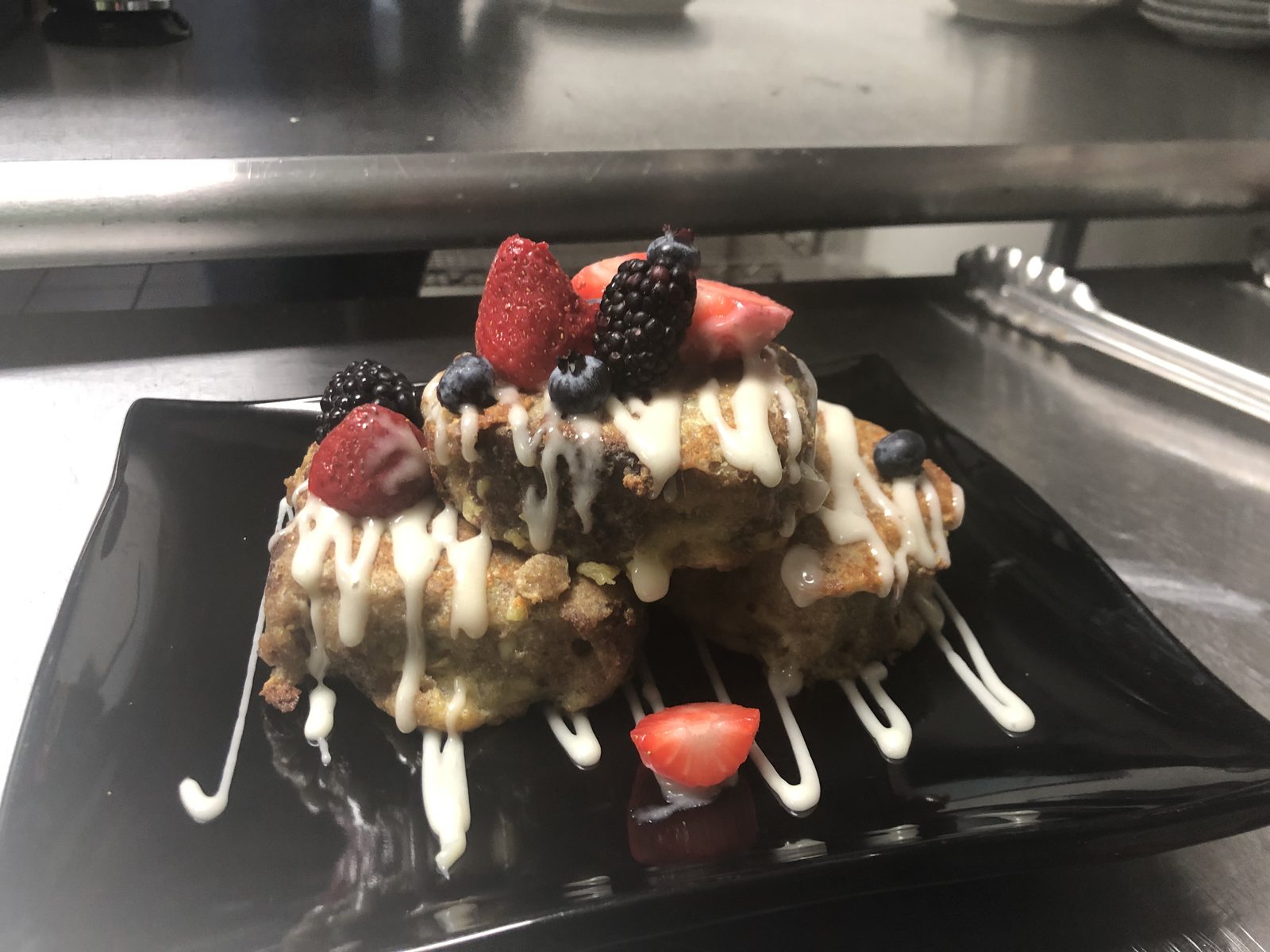 Cinnamon Roll Bread Pudding, Berries, Cream Cheese Drizzle