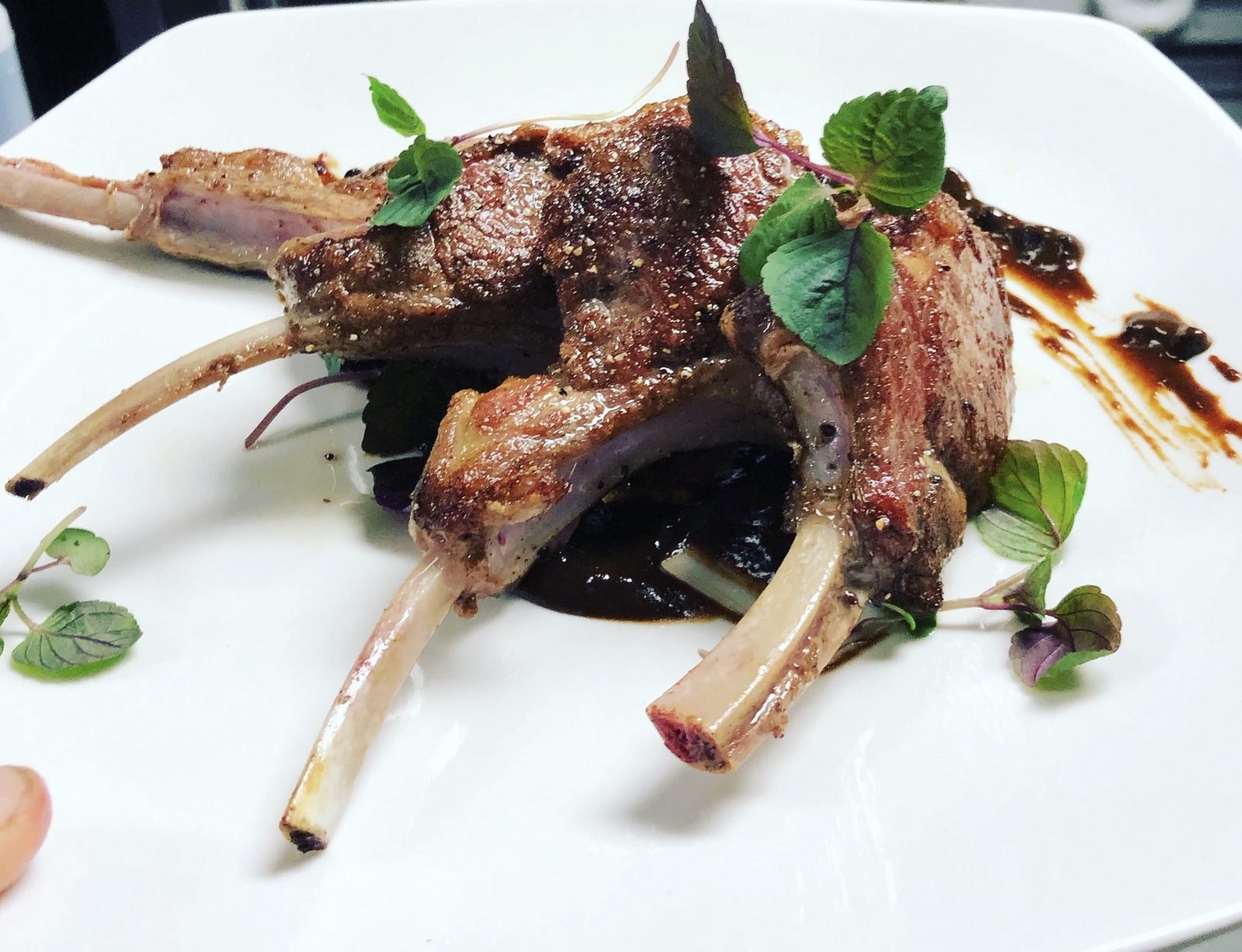 Lamb chop lollipop with roasted roma tomatoes and fig balsamic reduction, by Chef Tony Durso